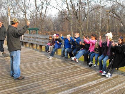 A large group of kids hearing a lesson.