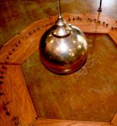 The end of a pendulum.